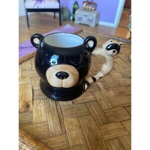 The cutest bear mug ever with a raccoon handle